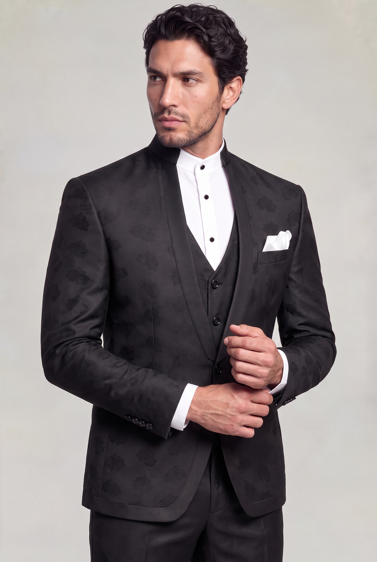Three-quarter front view of a black floral mandarin collar suit