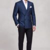 Full-length dark blue floral jacket with plain black trousers and polished shoes