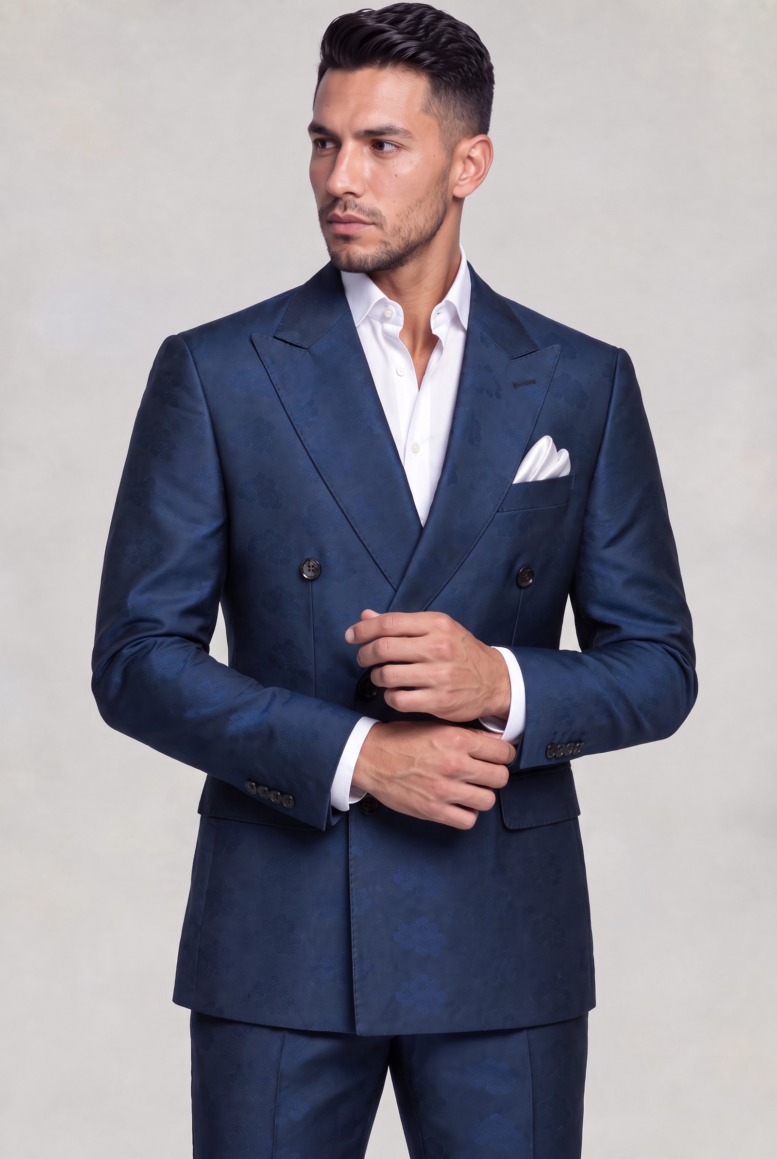 Double-breasted dark blue floral suit in a natural cuff-adjusting pose