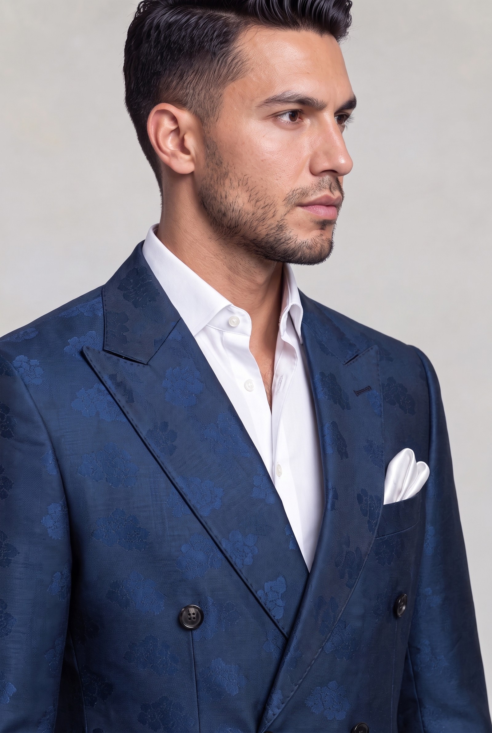 Close-up of floral peak lapel and white silk pocket square