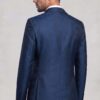 Rear view of dark blue floral suit jacket showing pattern and center seam