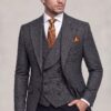 Dark grey plaid jacket and six-button vest with solid black trousers