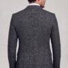 Rear view of dark grey plaid suit jacket showing tailored back and matching trousers