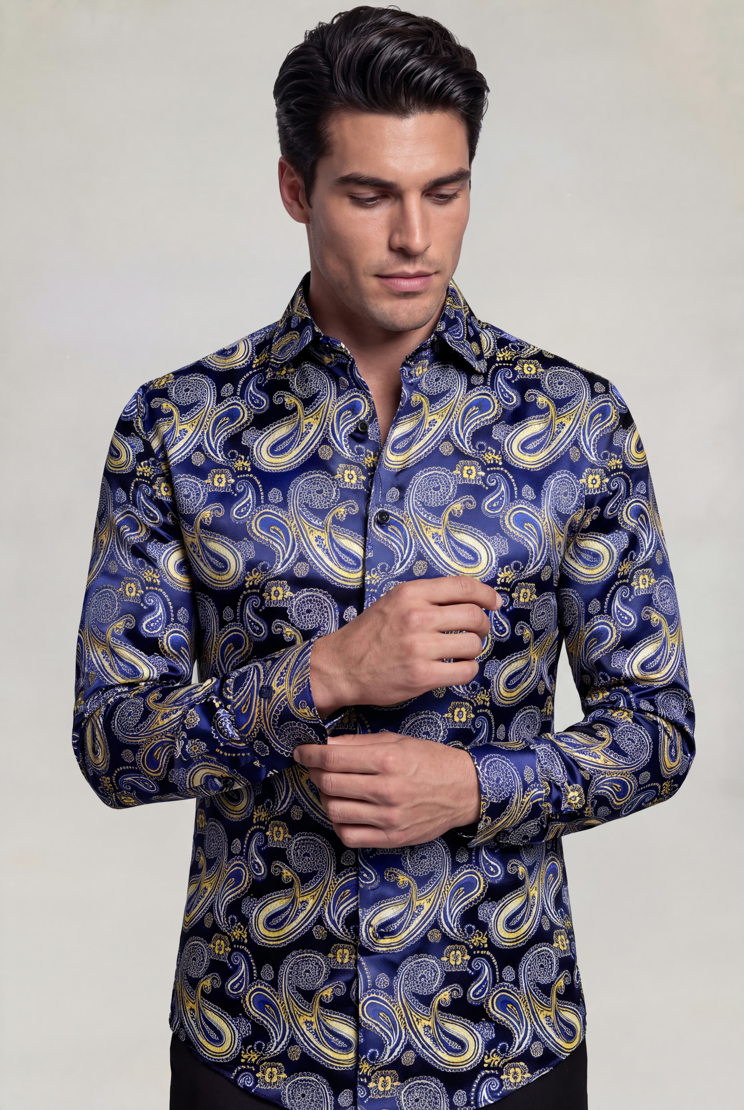 Men's navy blue and gold paisley shirt cuff pose from Gentleman's Guru