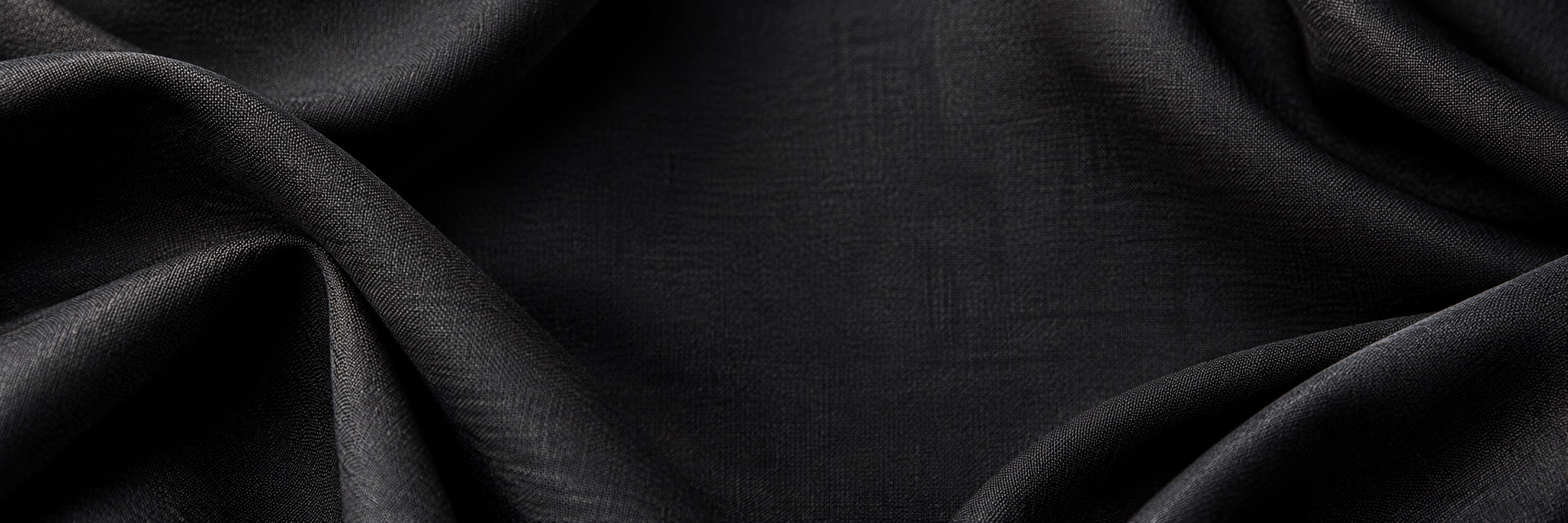 Charcoal fabric backdrop for men’s designer suits and tuxedos
